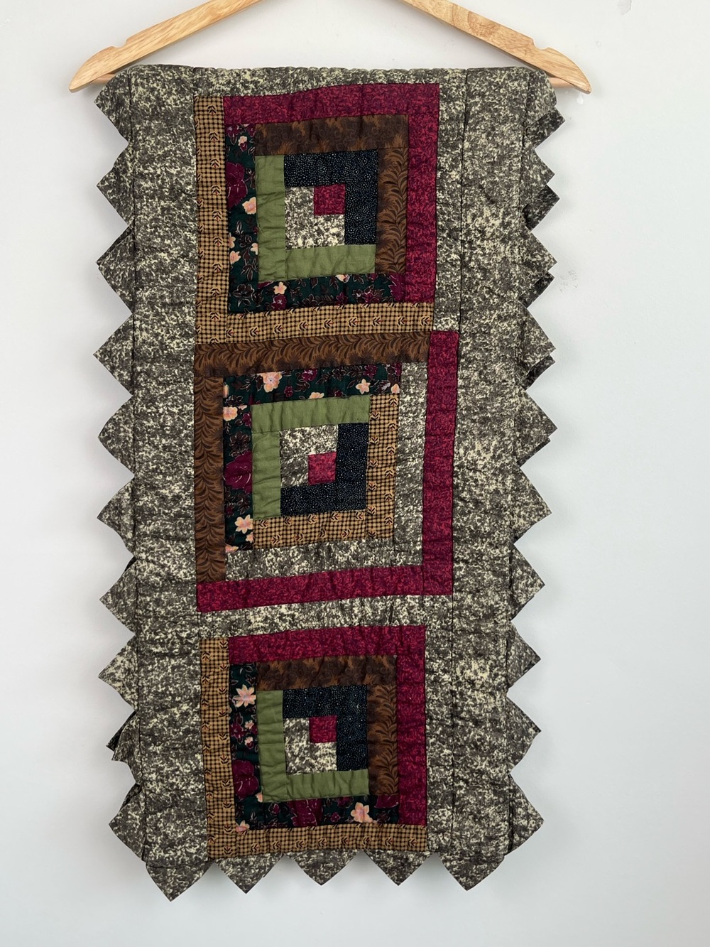 Donna Sharp quilted log cabin saw tooth trimmed table runner.